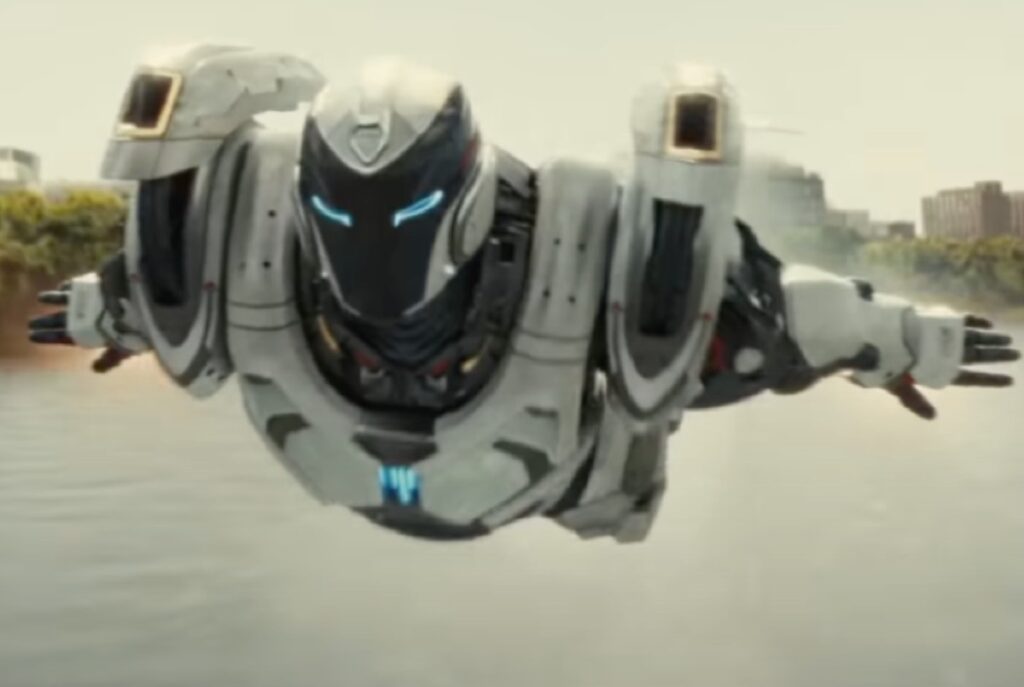 Ironheart in full exoskeleton suit flying over Chicago